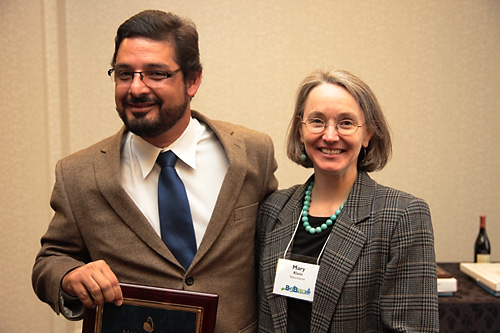 SalvaNATURA executive director Alvaro Moises receives the 2012 Conservation Impact Award from NatureServe president and CEO Mary Klein.